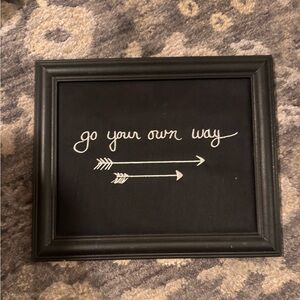 Creative Coop Black Embroidered “Go Your Own Way” Wall Art from Altar’d State